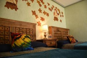 Voodi või voodid majutusasutuse HOTEL CASA LIMON toas