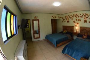 Voodi või voodid majutusasutuse HOTEL CASA LIMON toas