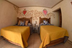 Voodi või voodid majutusasutuse HOTEL CASA LIMON toas