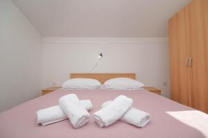 Postel nebo postele na pokoji v ubytování Apartmani Horvat