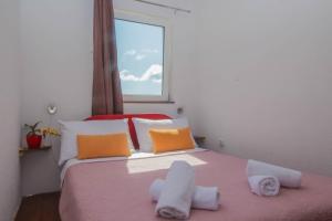 Postel nebo postele na pokoji v ubytování Apartmani Horvat