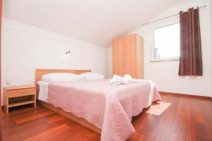 Postel nebo postele na pokoji v ubytování Apartmani Horvat