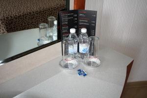 a group of glasses sitting on a counter with a mirror at Hotel Principe in Mexico City