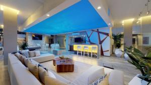a large living room with a couch and a table at Condominio Loft 268 Zona Romántica Departamento 510 in Puerto Vallarta
