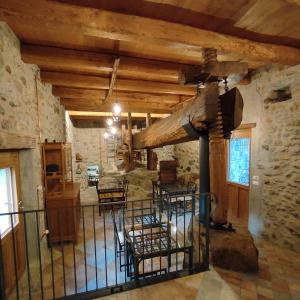 a room with chairs and a fireplace in a building at B&B Al Vecchio Torchio in Settimo Vittone