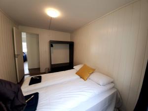 a large white bed in a small room at Bnb Central Apartment 5 Downtown Stavanger Stavanger in Stavanger