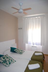 Postel nebo postele na pokoji v ubytování Hostal l'Estrella