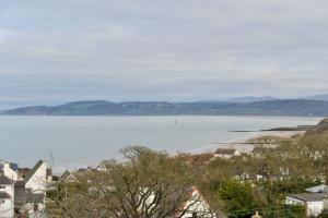 a view of a large body of water at Beach View in Benllech