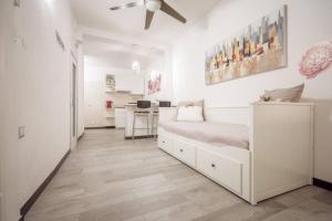 A bed or beds in a room at LE NOTTI GEMELLE