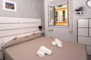 A bed or beds in a room at LE NOTTI GEMELLE Még 14 kép