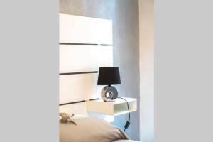 A bed or beds in a room at LE NOTTI GEMELLE