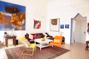 A seating area at Holidays in Tarajalejo - home office with sea view