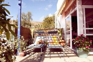 A garden outside Holidays in Tarajalejo - home office with sea view