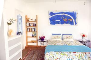 A bed or beds in a room at Holidays in Tarajalejo - home office with sea view