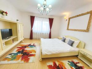 Un ou plusieurs lits dans un hébergement de l'établissement Casa Dușa - Apartament Romina