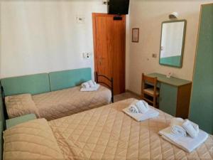 Postel nebo postele na pokoji v ubytování Hotel Sonne