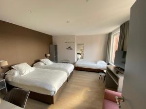 Ένα ή περισσότερα κρεβάτια σε δωμάτιο στο Hotel New Regina