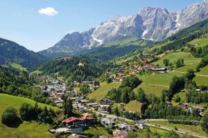 a small town in a valley in the mountains at Appartementhaus Hochkönig 1 - Wasserfall in Mühlbach am Hochkönig