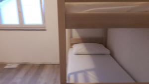 Posteľ alebo postele v izbe v ubytovaní Backpackers Home