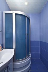 a blue bathroom with a shower and a sink at Argishti Street, 1 bedroom Modern apartment GL131 in Yerevan +14 photos