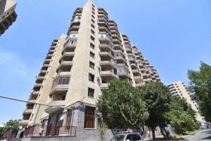 a tall building with a car parked in front of it at Argishti Street, 1 bedroom Modern apartment GL131 in Yerevan