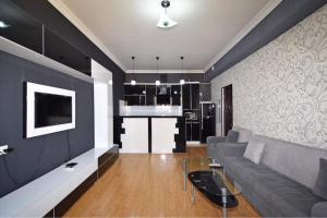 a living room with a couch and a table at Argishti Street, 1 bedroom Modern apartment GL131 in Yerevan