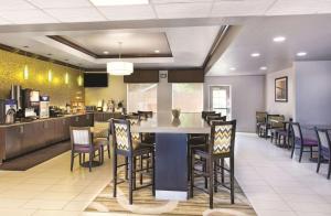 a dining room with a large table and chairs at La Quinta by Wyndham Tampa Bay Area-Tampa South in Tampa