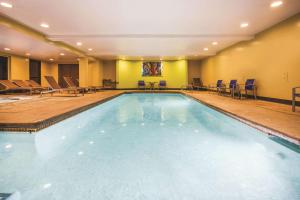 a large swimming pool in a hotel room at La Quinta by Wyndham Ely in Ely