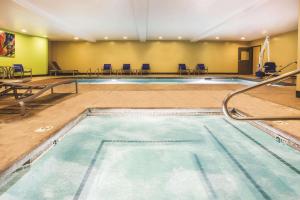 a large swimming pool in a hotel room at La Quinta by Wyndham Ely in Ely