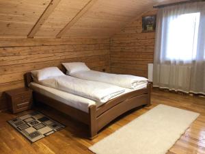 Postel nebo postele na pokoji v ubytování Вербовий двір - Willow Yard