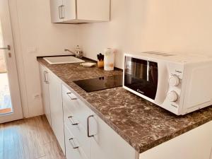 A kitchen or kitchenette at DEPENDANCE LAZISE LAGO DI GARDA