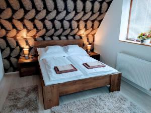 Posteľ alebo postele v izbe v ubytovaní Müezzin Apartman