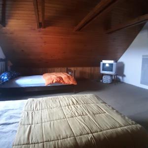 Ένα ή περισσότερα κρεβάτια σε δωμάτιο στο Chez Grand-Mère