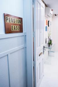 a door with a sign that reads permission ego at Pensión Easo in San Sebastián