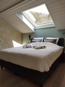 Postel nebo postele na pokoji v ubytování B&B Le Nid Doux (Vresse-Sur-Semois/Chairière)