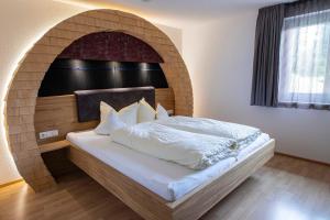 Ένα ή περισσότερα κρεβάτια σε δωμάτιο στο Hotel Lucia - 3 Sterne Superior