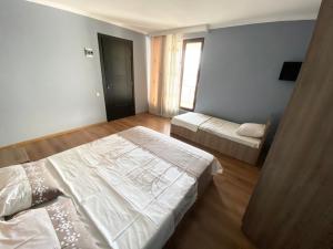 Letto o letti in una camera di Hotel Charli