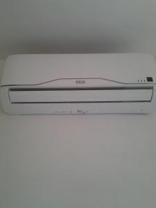 a white dvd player sitting on top of a table at Hotel Rustichello in Marina di Campo