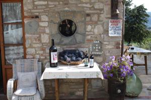 a table with two bottles of wine on it at Agriturismo Podere Somigli di Lorenzo Correani in Greve in Chianti