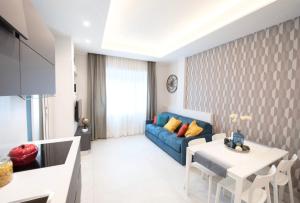 Łóżko lub łóżka w pokoju w obiekcie Napoli City Center - Appartamenti e Camere