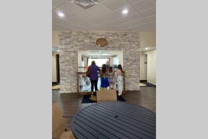 a group of people standing in a lobby at Eagle Mountain River Retreat in Ellijay
