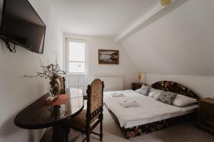 TV a/nebo společenská místnost v ubytování Hotel U Lípy