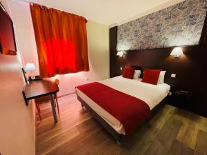 a bedroom with a bed and a desk and red curtains at Hôtel Restaurant Kyriad Direct DIJON NORD - Zenith - Toison d'Or in Dijon