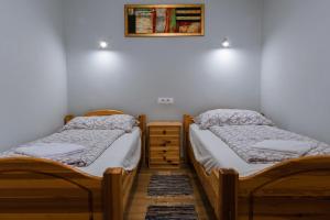 Postel nebo postele na pokoji v ubytování Julia Apartman