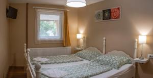 Postel nebo postele na pokoji v ubytování Julia Apartman