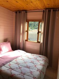 Ένα ή περισσότερα κρεβάτια σε δωμάτιο στο Casa Temporada flor do campo