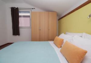 Postel nebo postele na pokoji v ubytování Apartmani Horvat