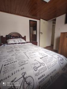 מיטה או מיטות בחדר ב-Hogar COLONIAL