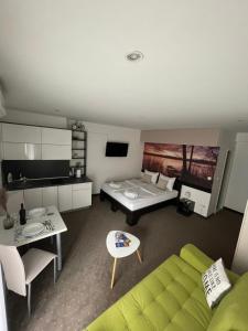 a living room with a couch and a table at Apartments & Rooms Villa Zaad FREE PRIVATE PARKING in Mostar