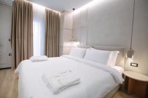 Postel nebo postele na pokoji v ubytování Boulevard Boutique Aparthotel
